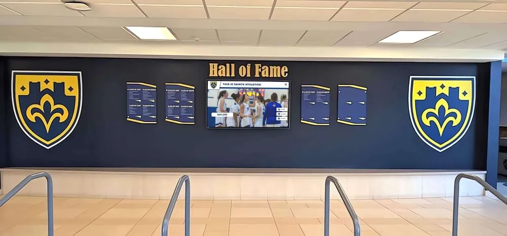 Traditional wall of honor displaying athletic achievements with plaques