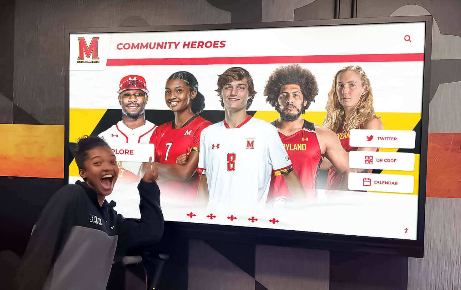 Student exploring interactive collegiate donor recognition display