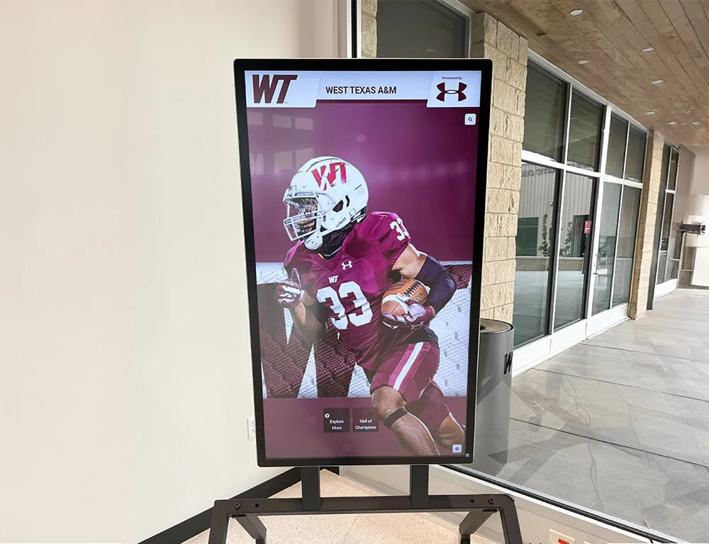 Digital display in lobby showcasing football player number 33 with career highlights